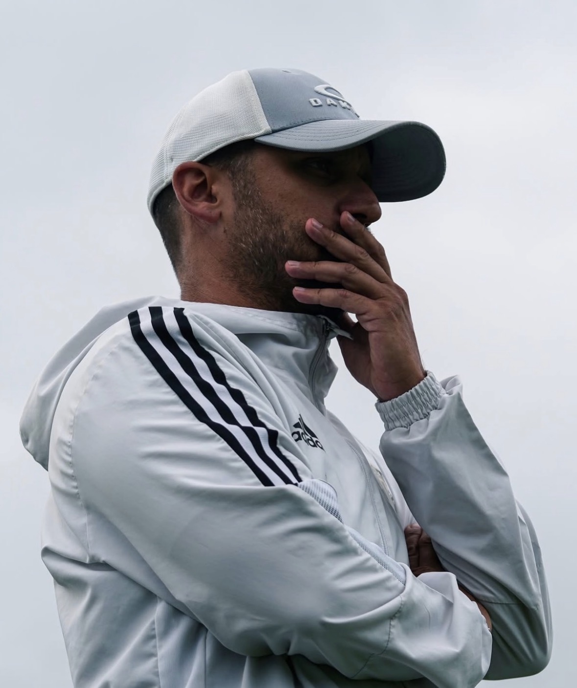 Mike Howard in thoughtful pose on sideline