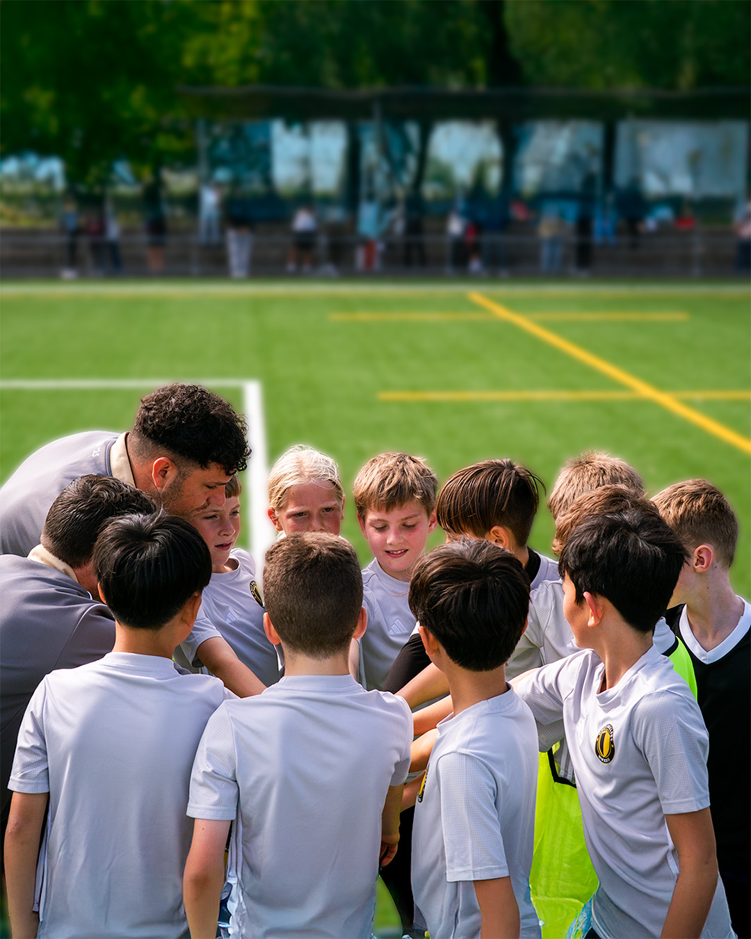 U10 team huddle during tactical discussion